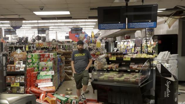 A worker steps over merchandise that is scattered on the floor of a Albertson's grocery store Saturday, July 6, 2019 following a earthquake in Ridgecrest, Calif.(AP) A worker steps over merchandise that is scattered on the floor of a Albertson's grocery store Saturday, July 6, 2019 following a earthquake in Ridgecrest, Calif.(AP)