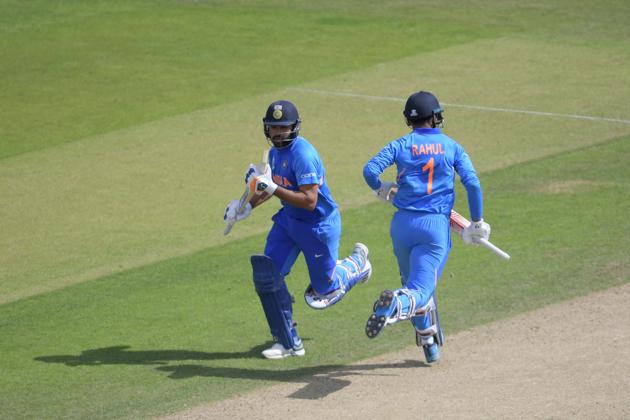 India's Rohit Sharma (L) and India's K.L. Rahul (R) take a run. (AFP)