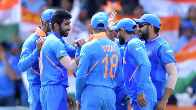 India's Jasprit Bumrah (2nd L) celebrates with teammates.(AFP)