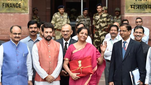 EDS PLS TAKE NOTE OF THIS PTI PICK OF THE DAY:::::::: New Delhi: Finance Minister Nirmala Sitharaman with MoS Anurag Thakur and others outside the North Block ahead of the presentation of Union Budget 2019-20 at Parliament, in New Delhi, Friday, July 05, 2019. (PTI Photo/Ravi Choudhary)(PTI7_5_2019_000023A)(PTI7_5_2019_000197B)(PTI Photo)