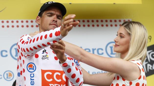 Belgium’s Greg Van Avermaet puts on the best climber’s dotted jersey after the first stage of the race with over 194.5 kilometers (120,86 miles) with start in Brussels and finish in Brussels. (Thibault Camus / AP) Belgium’s Greg Van Avermaet puts on the best climber’s dotted jersey after the first stage of the race with over 194.5 kilometers (120,86 miles) with start in Brussels and finish in Brussels. (Thibault Camus / AP)