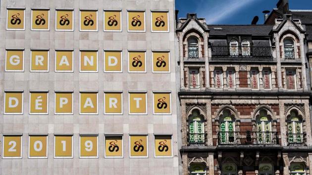 The windows of a building are decorated with the logo of Brussels Grand Depart 2019 in Brussels, three days prior to the start of the 106th edition of the Tour de France cycling race. (Jeff Pachoud / AFP)