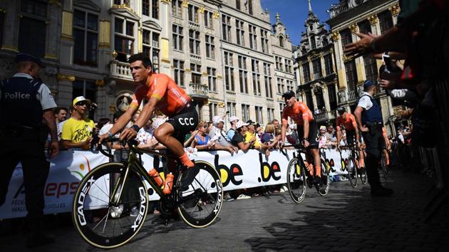 Belgium’s rider Greg Van Avermaet (L) of Poland’s CCC Team arrives with teammates for the team presentation ceremony at the Grand-Place - Grote Markt Square in Brussels two days prior to the start of the 106th edition of the Tour de France cycling race. (Anne-Christine Poujoulat / AFP) Belgium’s rider Greg Van Avermaet (L) of Poland’s CCC Team arrives with teammates for the team presentation ceremony at the Grand-Place - Grote Markt Square in Brussels two days prior to the start of the 106th edition of the Tour de France cycling race. (Anne-Christine Poujoulat / AFP)