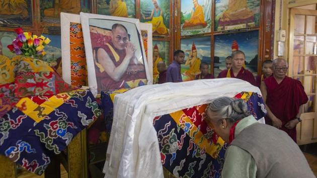 Jetsun Pema pays her respects in front of a portrait of her brother, Tibetan spiritual leader the Dalai Lama, at an event marking his 84th birthday at the Tsuglakhang temple in Dharmsala, Himachal Pradesh. (Ashwini Bhatia / AP)