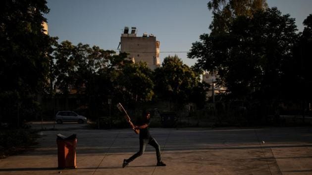 A man is ready to bat a ball during a tape-ball cricket game in a parking lot in the Tavros neighbourhood in Athens. In a barren Athens parking lot, young Pakistanis get in position for a game of cricket. On one end of the dust-covered concrete is a trash can; on the other, a pile of rocks. That is their pitch, and those are its wickets. (Alkis Konstantinidis / REUTERS) A man is ready to bat a ball during a tape-ball cricket game in a parking lot in the Tavros neighbourhood in Athens. In a barren Athens parking lot, young Pakistanis get in position for a game of cricket. On one end of the dust-covered concrete is a trash can; on the other, a pile of rocks. That is their pitch, and those are its wickets. (Alkis Konstantinidis / REUTERS)