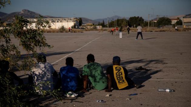 On Sundays, a growing community of street cricketers travels across the capital to the unlikeliest locations, from car parks to abandoned industrial grounds, engaging in tape-ball cricket - an informal version of the game invented in Pakistan, played using a tennis ball wrapped in electrical tape. About 50,000 Pakistanis live in Greece, the embassy estimates, many of them labourers in fields or factories. Others own shops or restaurants. (Alkis Konstantinidis / REUTERS) On Sundays, a growing community of street cricketers travels across the capital to the unlikeliest locations, from car parks to abandoned industrial grounds, engaging in tape-ball cricket - an informal version of the game invented in Pakistan, played using a tennis ball wrapped in electrical tape. About 50,000 Pakistanis live in Greece, the embassy estimates, many of them labourers in fields or factories. Others own shops or restaurants. (Alkis Konstantinidis / REUTERS)