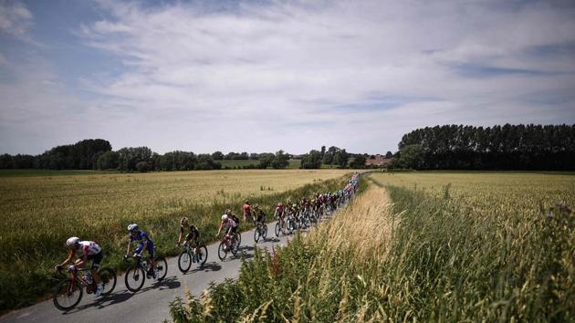 Riders form the pack cycle on a road in the countryside during the first stage of the 106th edition of the Tour de France cycling race on July 6th. (Marco Bertorello / AFP) Riders form the pack cycle on a road in the countryside during the first stage of the 106th edition of the Tour de France cycling race on July 6th. (Marco Bertorello / AFP)