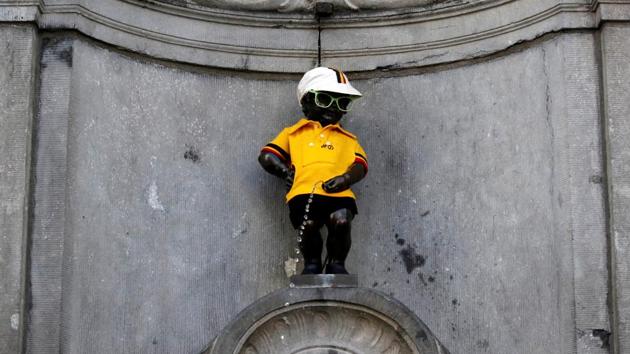 The iconic Manneken Pis is dressed in the overall leader’s yellow jersey, before the start of stage one. (Christian Hartmann / REUTERS) The iconic Manneken Pis is dressed in the overall leader’s yellow jersey, before the start of stage one. (Christian Hartmann / REUTERS)