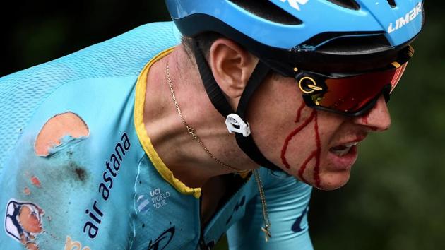 Astana Pro Team rider Jakob Fuglsang of Denmark bleeds as he rides after a crash with just 11 miles to go. (Jeff Pachoud / REUTERS) Astana Pro Team rider Jakob Fuglsang of Denmark bleeds as he rides after a crash with just 11 miles to go. (Jeff Pachoud / REUTERS)