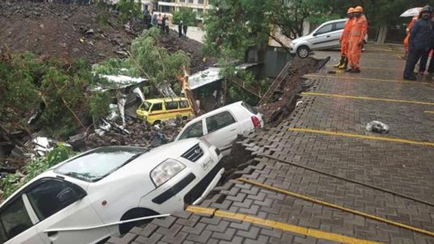 According to residents, labourers should be insured by contractors for safety. (In pic) A displaced car at the site where a compound wall of a society collapsed on shanties adjacent to it in Kondhwa.(HT/PHOTO) According to residents, labourers should be insured by contractors for safety. (In pic) A displaced car at the site where a compound wall of a society collapsed on shanties adjacent to it in Kondhwa.(HT/PHOTO)
