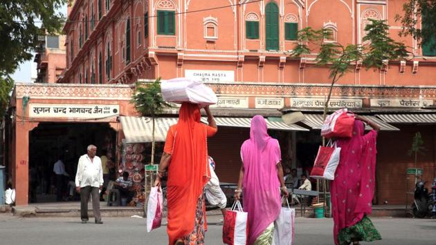 Women with goods purchased seen near an old market in Jaipur. Markets, stalls, residences and temples built along the main streets have uniform facades. “Designed to be a commercial capital, the city has maintained its local commercial, artisanal and cooperative traditions to this day,” the UNESCO India Office said in a statement. (Himanshu Vyas / HT Photo) Women with goods purchased seen near an old market in Jaipur. Markets, stalls, residences and temples built along the main streets have uniform facades. “Designed to be a commercial capital, the city has maintained its local commercial, artisanal and cooperative traditions to this day,” the UNESCO India Office said in a statement. (Himanshu Vyas / HT Photo)