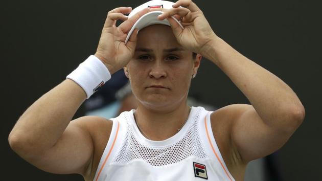 Australia's Ashleigh Barty adjusts her cap during a break in a women's singles match.(AP)