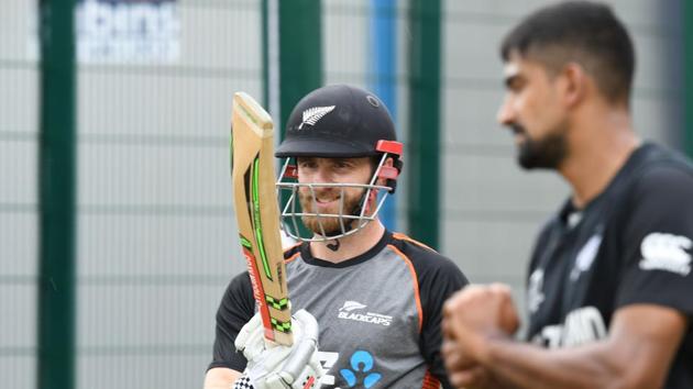 New Zealand's captain Kane Williamson (L) speaks with teammate Ish Sodhi as he bats in the nets.(AFP)