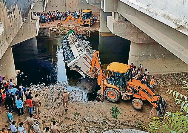 The mangled remains of UP Roadways bus after it skidded off the six-lane Yamuna Expressway and fell into a large drain where at least 29 people have been killed in the mishap near Agra on Monday.(ANI Photo) The mangled remains of UP Roadways bus after it skidded off the six-lane Yamuna Expressway and fell into a large drain where at least 29 people have been killed in the mishap near Agra on Monday.(ANI Photo)