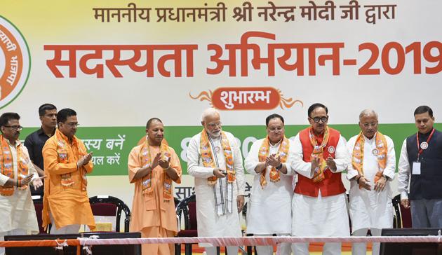 Varanasi: Prime Minister Narendra Modi with Uttar Pradesh Chief Minister Yogi Adityanath at the launch of BJP membership drive, in Varanasi, Saturday, July 6, 2019. Also seen is BJP Working President JP Nadda. (PTI Photo) (PTI7_6_2019_000050B) (PTI) Varanasi: Prime Minister Narendra Modi with Uttar Pradesh Chief Minister Yogi Adityanath at the launch of BJP membership drive, in Varanasi, Saturday, July 6, 2019. Also seen is BJP Working President JP Nadda. (PTI Photo) (PTI7_6_2019_000050B) (PTI)