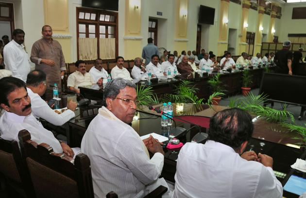 Former chief minister Siddaramaiah, KPCC President Dinesh Gundurao, AICC General Secretary KC Venugopal and other leaders during a meeting of the Congress legislators at Vidhana Soudha. “According to us these are anti-party activities and they (rebels) have colluded with the BJP. These people are trapped. Even now I request them to come back, withdraw their resignations. The party has taken a decision requesting their disqualification,” Siddaramaiah said. (Shailendra Bhojak / PTI) Former chief minister Siddaramaiah, KPCC President Dinesh Gundurao, AICC General Secretary KC Venugopal and other leaders during a meeting of the Congress legislators at Vidhana Soudha. “According to us these are anti-party activities and they (rebels) have colluded with the BJP. These people are trapped. Even now I request them to come back, withdraw their resignations. The party has taken a decision requesting their disqualification,” Siddaramaiah said. (Shailendra Bhojak / PTI)