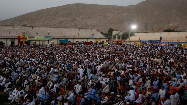 People watch traditional music performance during the Hazara Culture Day celebration at the Qayum Papa Stadium. The community held its first Hazara Culture Day to celebrate and showcase its history, music and traditions as it strives to keep its protests peaceful, despite unrest stirred up by militants looking to pit people of different sects against each other, said Abdul Khaliq Hazara, chairman of the Hazara Democratic Party (HDP), which has two provincial assembly representatives. (Akhtar Soomro / REUTERS) People watch traditional music performance during the Hazara Culture Day celebration at the Qayum Papa Stadium. The community held its first Hazara Culture Day to celebrate and showcase its history, music and traditions as it strives to keep its protests peaceful, despite unrest stirred up by militants looking to pit people of different sects against each other, said Abdul Khaliq Hazara, chairman of the Hazara Democratic Party (HDP), which has two provincial assembly representatives. (Akhtar Soomro / REUTERS)