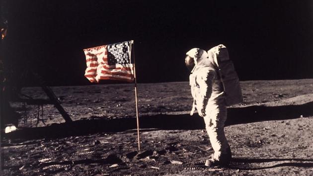 Buzz Aldrin poses for a photograph beside the US flag on the moon on July 20, 1969. A popular conspiracy theory questions why the flag is seen in this photo as fluttering like it would on earth.(AP File Photo) Buzz Aldrin poses for a photograph beside the US flag on the moon on July 20, 1969. A popular conspiracy theory questions why the flag is seen in this photo as fluttering like it would on earth.(AP File Photo)