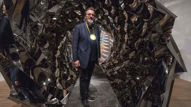 Icelandic/Danish artist Olafur Eliasson poses for a photograph beside his art installation titled "Your Spiral View" during a press-preview at Tate Modern in London. (Niklas HALLE'N / AFP) Icelandic/Danish artist Olafur Eliasson poses for a photograph beside his art installation titled "Your Spiral View" during a press-preview at Tate Modern in London. (Niklas HALLE'N / AFP)