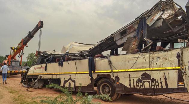 Mangled remains of a UP Roadways bus after it fell into a drain off the Yamuna Expressway near Agra, killing 29 passengers, July 8, 2019.(PTI) Mangled remains of a UP Roadways bus after it fell into a drain off the Yamuna Expressway near Agra, killing 29 passengers, July 8, 2019.(PTI)