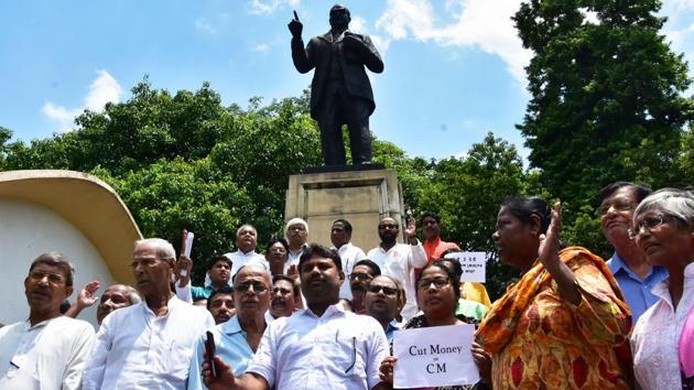 Congress MLAs and Left parties’ MLAs walkout from the West Bengal assembly protesting against CM Mamata Banerjee over the ongoing 'cut money’ issue in Kolkata on Tuesday. (ANI Photo) Congress MLAs and Left parties’ MLAs walkout from the West Bengal assembly protesting against CM Mamata Banerjee over the ongoing 'cut money’ issue in Kolkata on Tuesday. (ANI Photo)