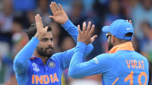 India's Ravindra Jadeja (L) celebrates with India's captain Virat Kohli.(AFP)