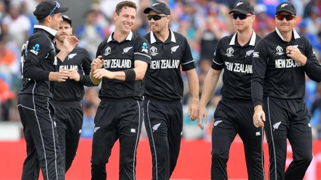 New Zealand's Matt Henry celebrates with teammates after taking the wicket of India's Rohit Sharma. (AFP) New Zealand's Matt Henry celebrates with teammates after taking the wicket of India's Rohit Sharma. (AFP)