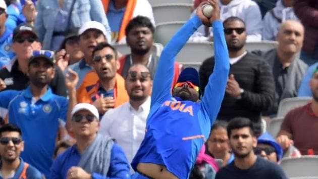 India's Ravindra Jadeja makes the catch to take the wicket of New Zealand's Tom Latham.(AFP)