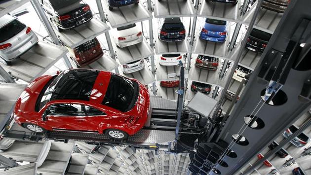 A Volkswagen New Beetle car is lifted inside a delivery tower after the company’s annual press conference in Wolfsburg, Germany, on March 12, 2012. The end of the Beetle comes at a turning point for Volkswagen as it rebounds from a scandal over cars rigged to cheat on diesel emissions tests. (Michael Sohn / AP) A Volkswagen New Beetle car is lifted inside a delivery tower after the company’s annual press conference in Wolfsburg, Germany, on March 12, 2012. The end of the Beetle comes at a turning point for Volkswagen as it rebounds from a scandal over cars rigged to cheat on diesel emissions tests. (Michael Sohn / AP)