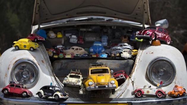 A collection of beetle car toys is seen on a Volkswagen Beetle displayed during the annual gathering of the “Beetle Club” in Yakum, central Israel, on April 21, 2017. Volkswagen is halting production of the last version of its Beetle model in July 2019 at its plant in Puebla, Mexico, the end of the road for a vehicle that has symbolized many things over a history spanning eight decades since 1938. (Oded Balilty / AP) A collection of beetle car toys is seen on a Volkswagen Beetle displayed during the annual gathering of the “Beetle Club” in Yakum, central Israel, on April 21, 2017. Volkswagen is halting production of the last version of its Beetle model in July 2019 at its plant in Puebla, Mexico, the end of the road for a vehicle that has symbolized many things over a history spanning eight decades since 1938. (Oded Balilty / AP)