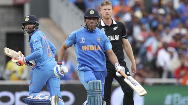 New Zealand's James Neesham, right, watches as India's MS Dhoni, center, and Ravindra Jadeja run. (AP) New Zealand's James Neesham, right, watches as India's MS Dhoni, center, and Ravindra Jadeja run. (AP)