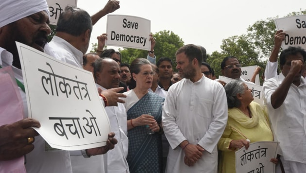 A number of top Congress leaders, including Sonia Gandhi, Rahul Gandhi and Anand Sharma, protested near the Gandhi statue in the Parliament complex and shouted slogans.(Sonu Mehta/ HT Photo)