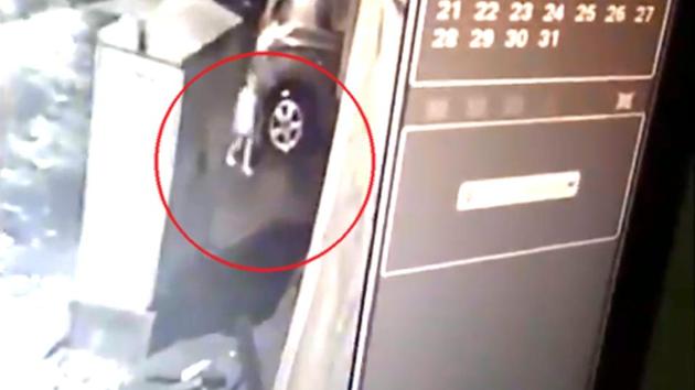 A CCTV footage shows Divyanshu Singh near the drain and then walking beyond an electrical enclosure box before falling inside.(Screengrab/ANI Twitter) A CCTV footage shows Divyanshu Singh near the drain and then walking beyond an electrical enclosure box before falling inside.(Screengrab/ANI Twitter)