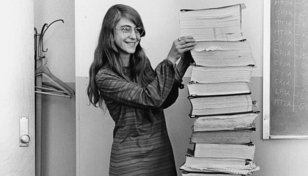 Margaret Hamilton standing next to the listings of the software she and her MIT team produced for the Apollo project in 1969.(Photo: Wikimedia Commons)