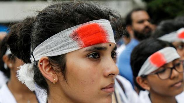 Medical students wearing mock bandages participate in a protest called by Indian Medical Association (IMA), during a nationwide doctors strike in Kochi. A 10-member committee to examine the feasibility of enacting a central law to stop violence against doctors across states by the Union Cabinet. (REUTERS FILE PHOTO) Medical students wearing mock bandages participate in a protest called by Indian Medical Association (IMA), during a nationwide doctors strike in Kochi. A 10-member committee to examine the feasibility of enacting a central law to stop violence against doctors across states by the Union Cabinet. (REUTERS FILE PHOTO)