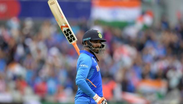India's Ravindra Jadeja celebrates scoring 50(AFP)