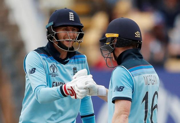 England's Eoin Morgan and Joe Root celebrate after the match. (Reuters)