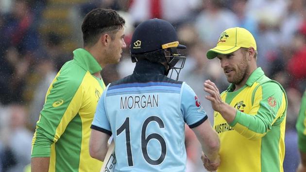 England's captain Eoin Morgan, center, shakes hands with Australia's captain Aaron Finch.(AP)