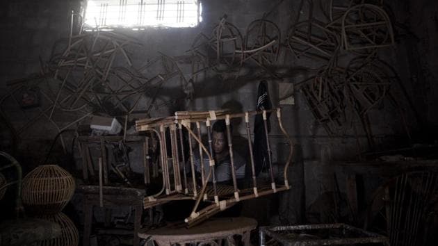 A Palestinian works at a bamboo workshop in Gaza City. Its living room sets, recliners, dining tables and chairs were once shipped to markets in the West Bank, Israel, Persian Gulf and America. The business flourished from 1975 until the outbreak of the second Palestinian uprising in 2000. (Khalil Hamra / AP)