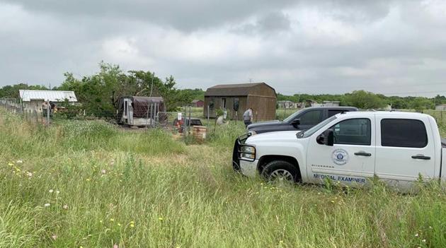 This May 20, 2019 photo provided by the Johnson County Sheriff's Office shows a medical examiners truck on the property of Freddie Mack's home in Venus, Texas. Authorities said Tuesday, July 9 thatthe 57-year-old Mack, who had been missing for months, was eaten, bones and all, by his dogs. Johnson County Sheriff Adam King says Mack had serious health problems and it's unclear whether his 18 dogs killed him or consumed his body after he died from a medical condition. A relative reported Mack missing in May.(AP)