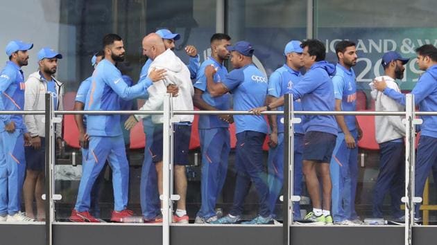 Indian cricketers greet each other after their team lost the Cricket World Cup semifinal.(AP)