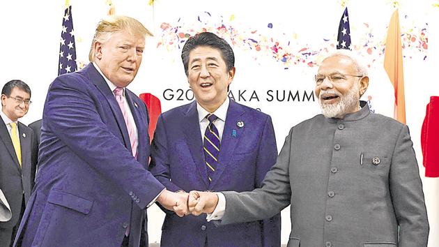 US President Donald Trump does a fist bump with Japan's Prime Minister Shinzo Abe and Prime Minister Narendra Modi during a trilateral meeting on the first day of the G20 summit on June 28, 2019, Osaka, Japan.(REUTERS)