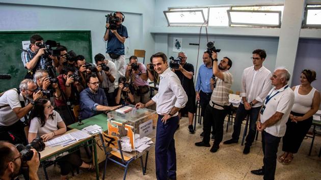 Greece’s opposition party New Democracy leader Kyriakos Mitsotakis casts his vote during general elections at a polling station in Athens. Greek voters are casting their ballots in the country’s first national election of the post-bailout era. (Angelos Tzortzinis / AFP)