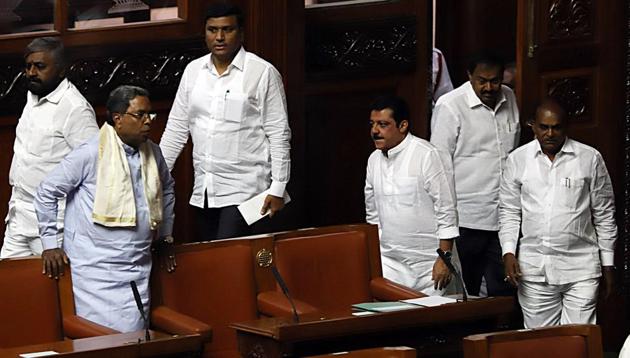 Karnataka political crisis: Former chief minister of Karnataka and Congress leader K. Siddaramaiah arrives along with other MLAs at the Karnataka Legislative Assembly in Bengaluru on Friday. (ANI photo) Karnataka political crisis: Former chief minister of Karnataka and Congress leader K. Siddaramaiah arrives along with other MLAs at the Karnataka Legislative Assembly in Bengaluru on Friday. (ANI photo)