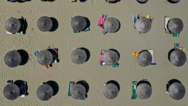 Parasols seen on a beach of the Adriatic Sea in Durres, as heatwave sweeps through Europe. Temperatures rose to 39 degrees Celsius in Albania. (Gent Shkullaku / AFP)