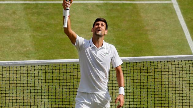 Novak Djokovic celebrates after winning his semi-final match against Spain's Roberto Bautista Agut at Wimbledon.(REUTERS)