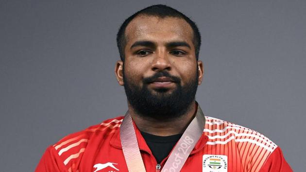 Pardeep Singh wins a gold medal in 109 Kg weightlifting.(AFP)