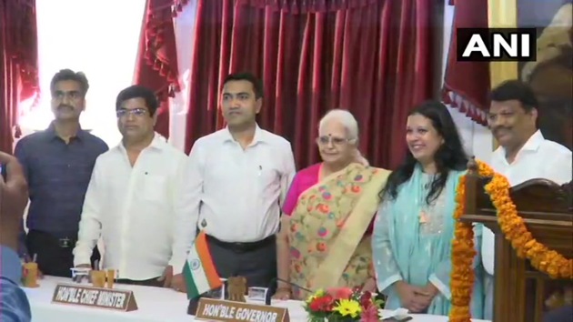 Goa Chief Minister Pramod Sawant and Governor Mridula Sinha with the four new ministers after they were sworn in on Saturday.(ANI)