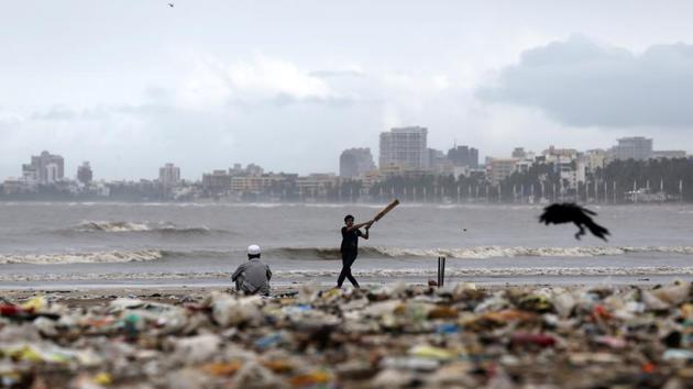 A boy plays cricket on the Juhu beach in Mumbai, Maharashtra. (Francis Mascarenhas / REUTERS) A boy plays cricket on the Juhu beach in Mumbai, Maharashtra. (Francis Mascarenhas / REUTERS)