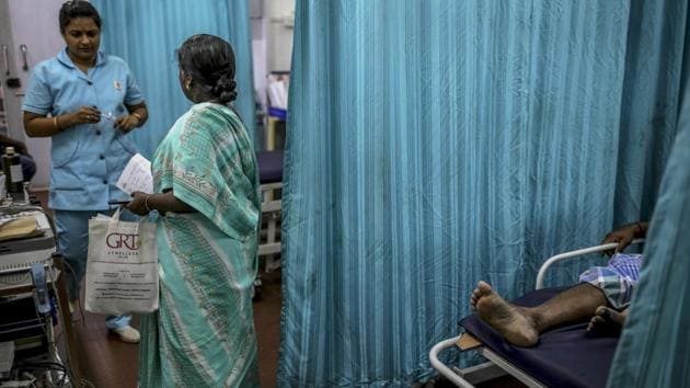 A nurse and a visitor in the emergency ward at a Sudar Hospitals clinic. Elsewhere, hospitals face similar challenges. Ashok Thorat, chief medical officer at a state-run hospital in Beed, Maharashtra said, “More people turn up at our government hospital because private clinics have to pay more to buy water and pass on costs to patients. We can arrange at least some free water from the municipal corporation, but even that has limits.” (Dhiraj Singh / Bloomberg)